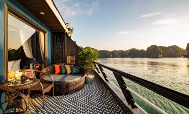 Stunning view from a luxury cruise balcony in Halong Bay, perfect for relaxing and enjoying the scen.