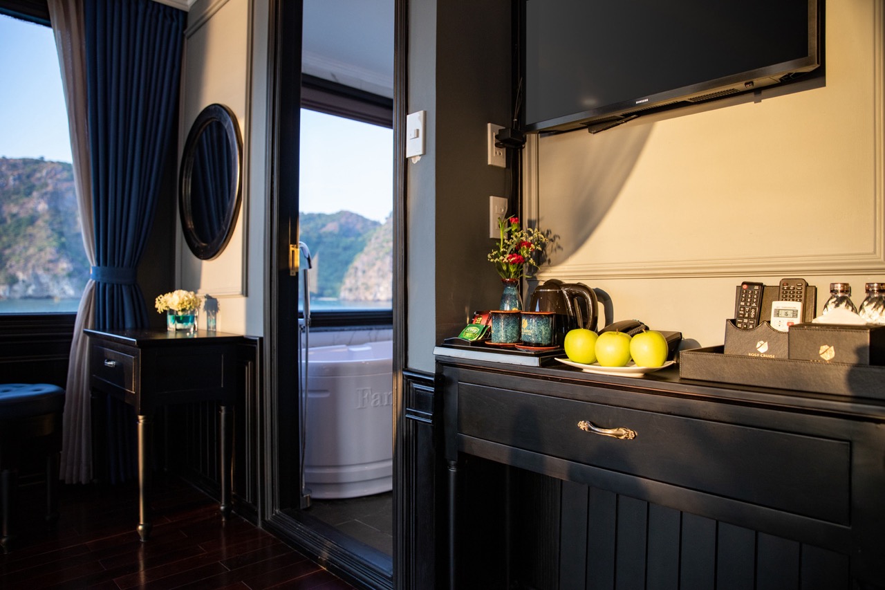 Scenic Halong Bay cruise balcony showcasing stunning mountain vistas and luxurious comfort for an un.