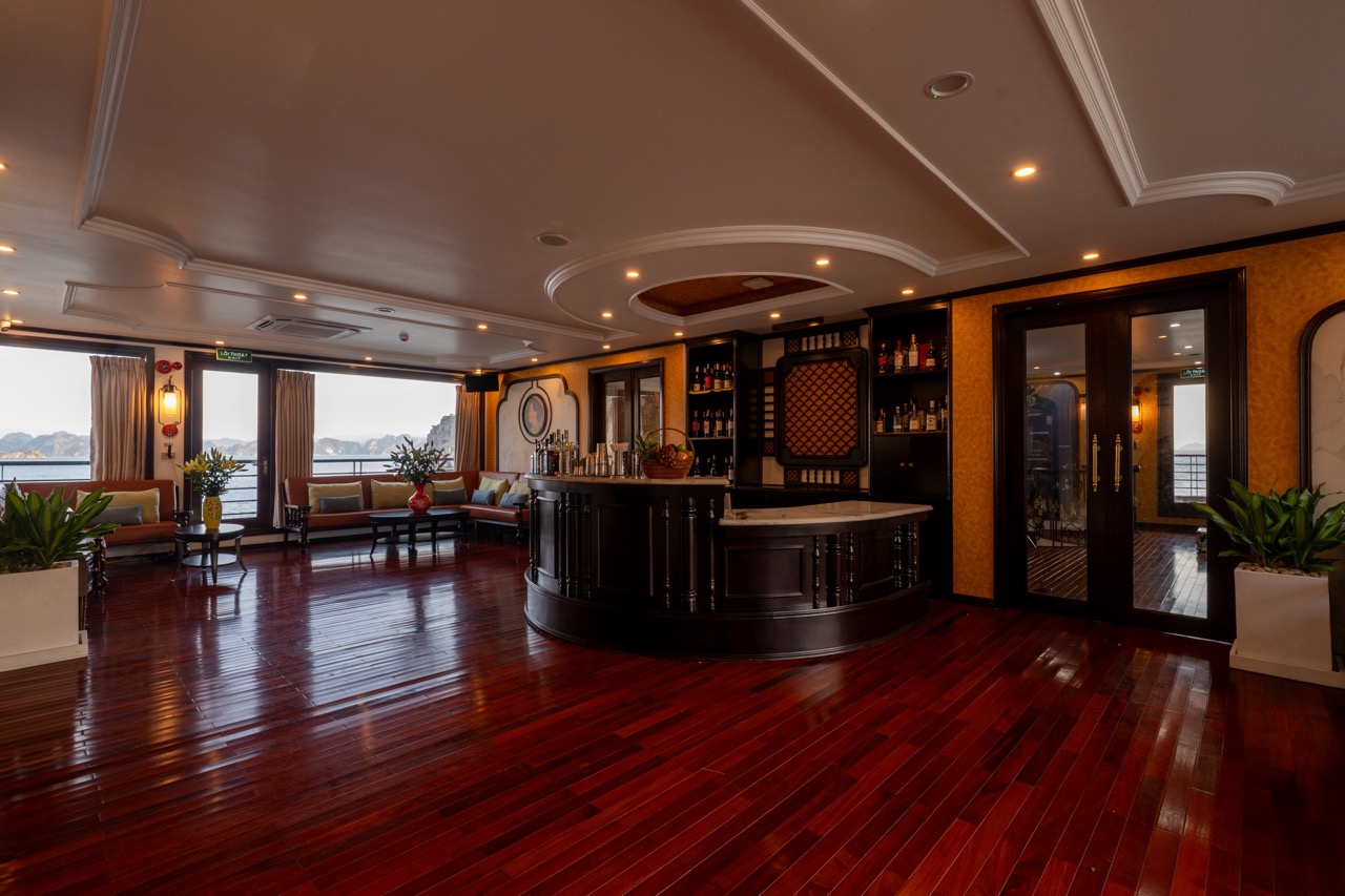 Elegant cruise lounge interior with panoramic windows and wooden flooring, perfect for relaxing duri.