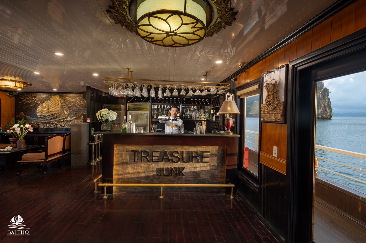 Elegant cruise bar scene on Bai Tu Long Bay with ocean view and luxurious ambiance.