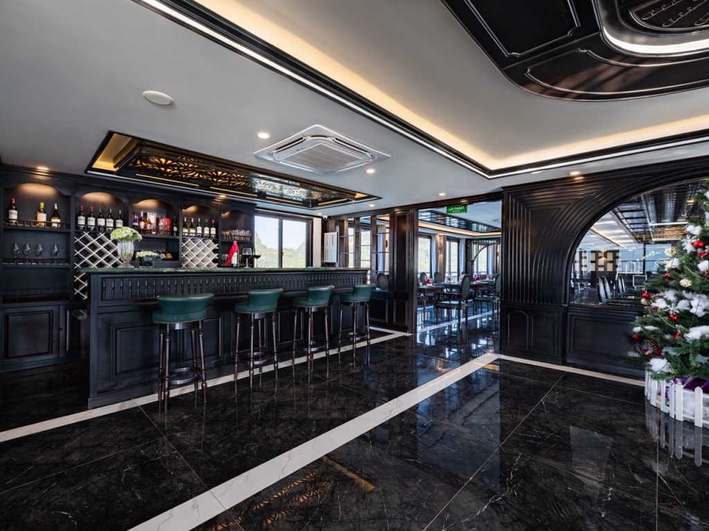 Luxurious cruise lounge with panoramic windows and elegant decor in Halong Bay.