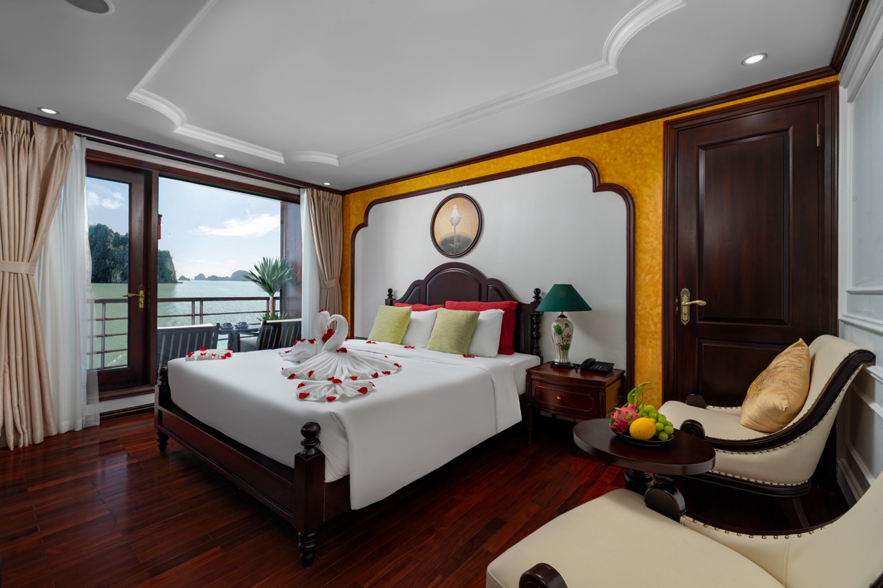 Elegant cruise balcony overlooking Halong Bay with lush scenery and tranquil waters. Perfect for a r.