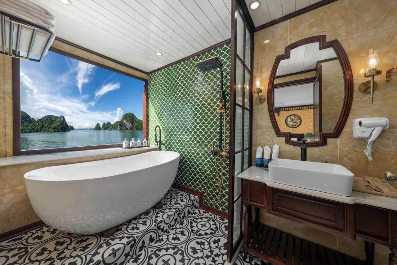Luxurious cruise bathroom overlooking Bai Tu Long Bay, perfect for relaxing after exploring the stun.