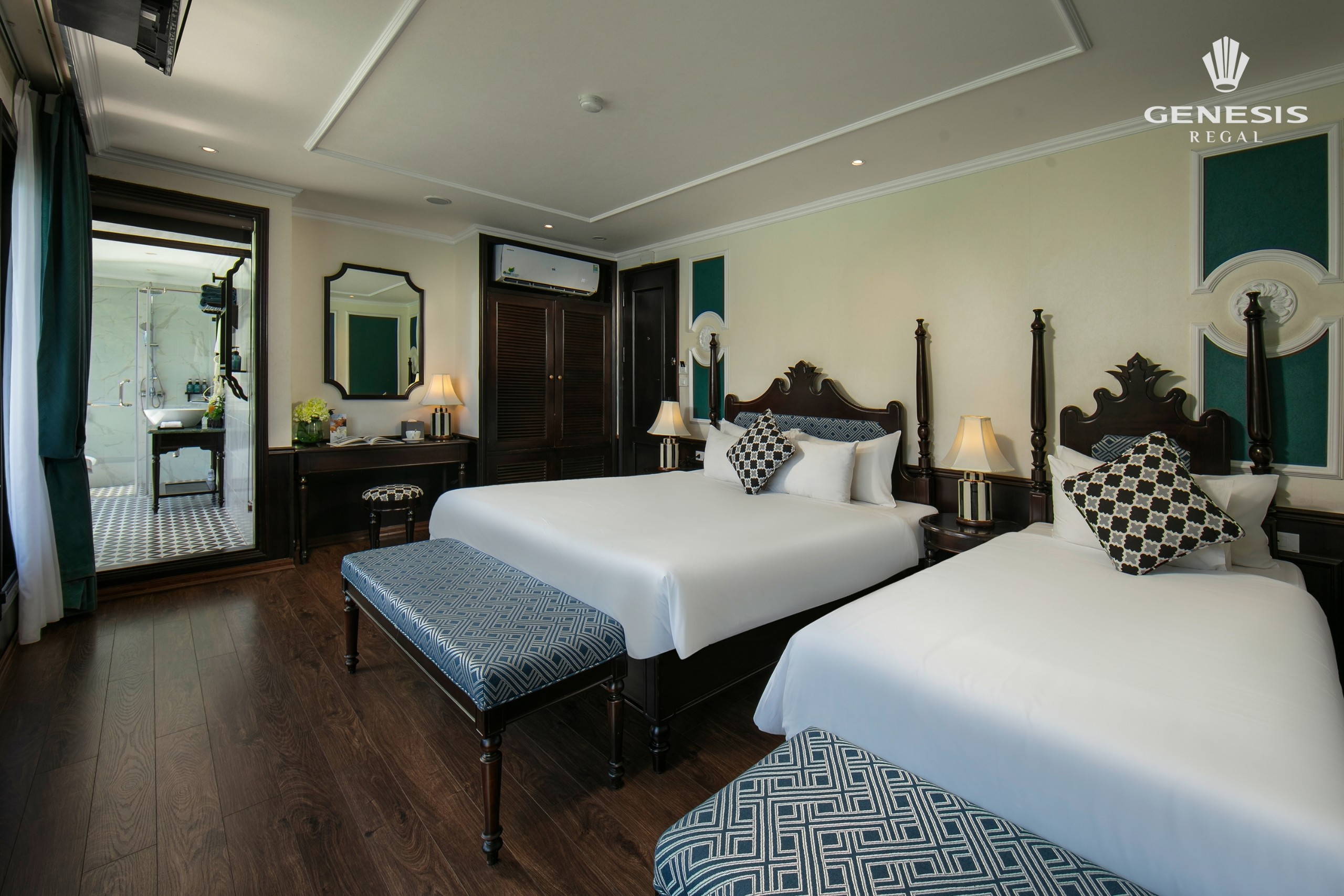 Elegant interior with comfortable beds and modern decor, perfect for a relaxing Halong Bay cruise ex.