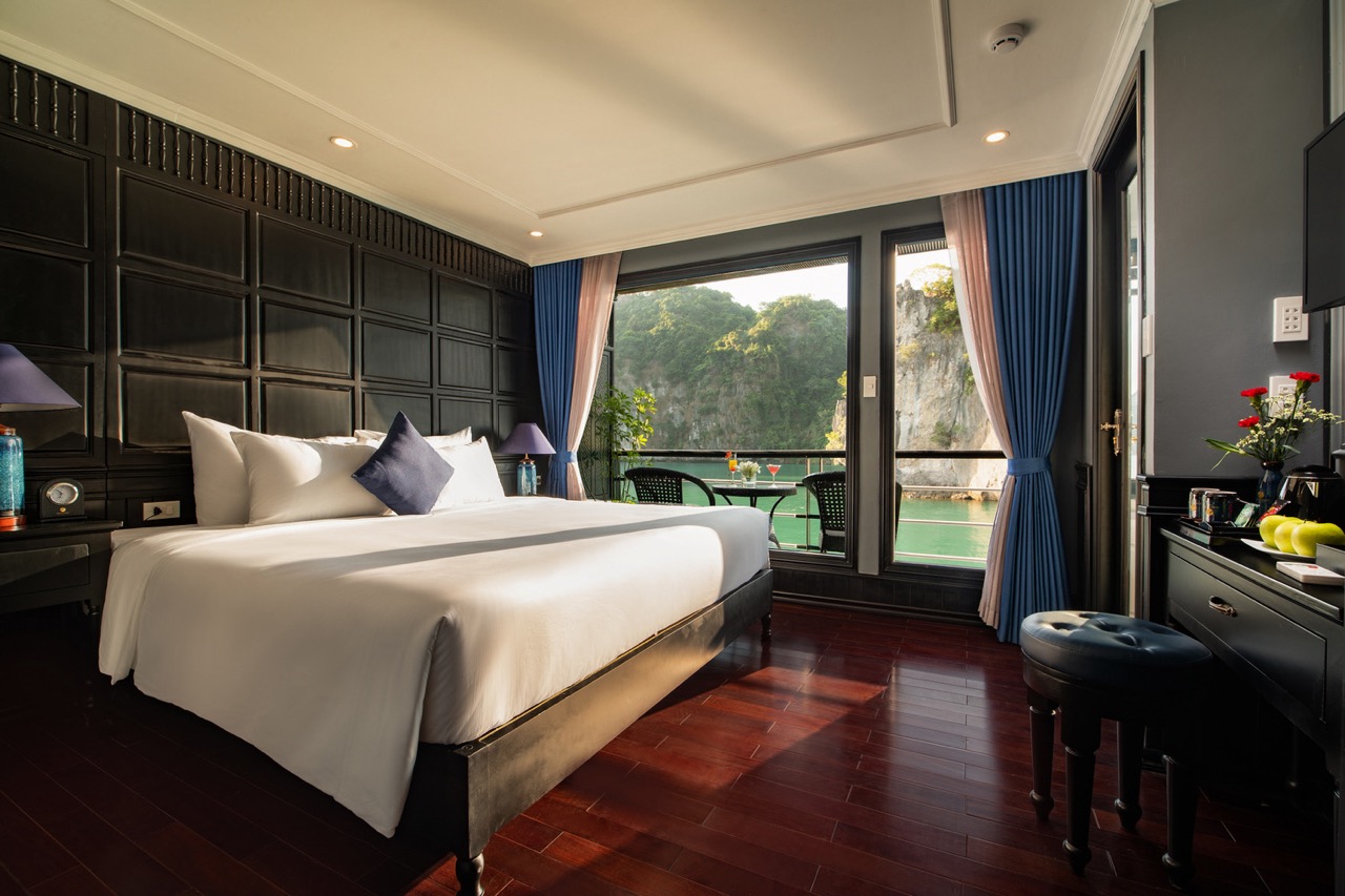 Scenic view of Halong Bay from a cruise balcony, perfect for a relaxing and luxurious travel experie.
