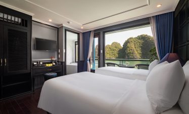 Scenic view of Halong Bay from a luxury cruise balcony, perfect for a relaxing and memorable travel.