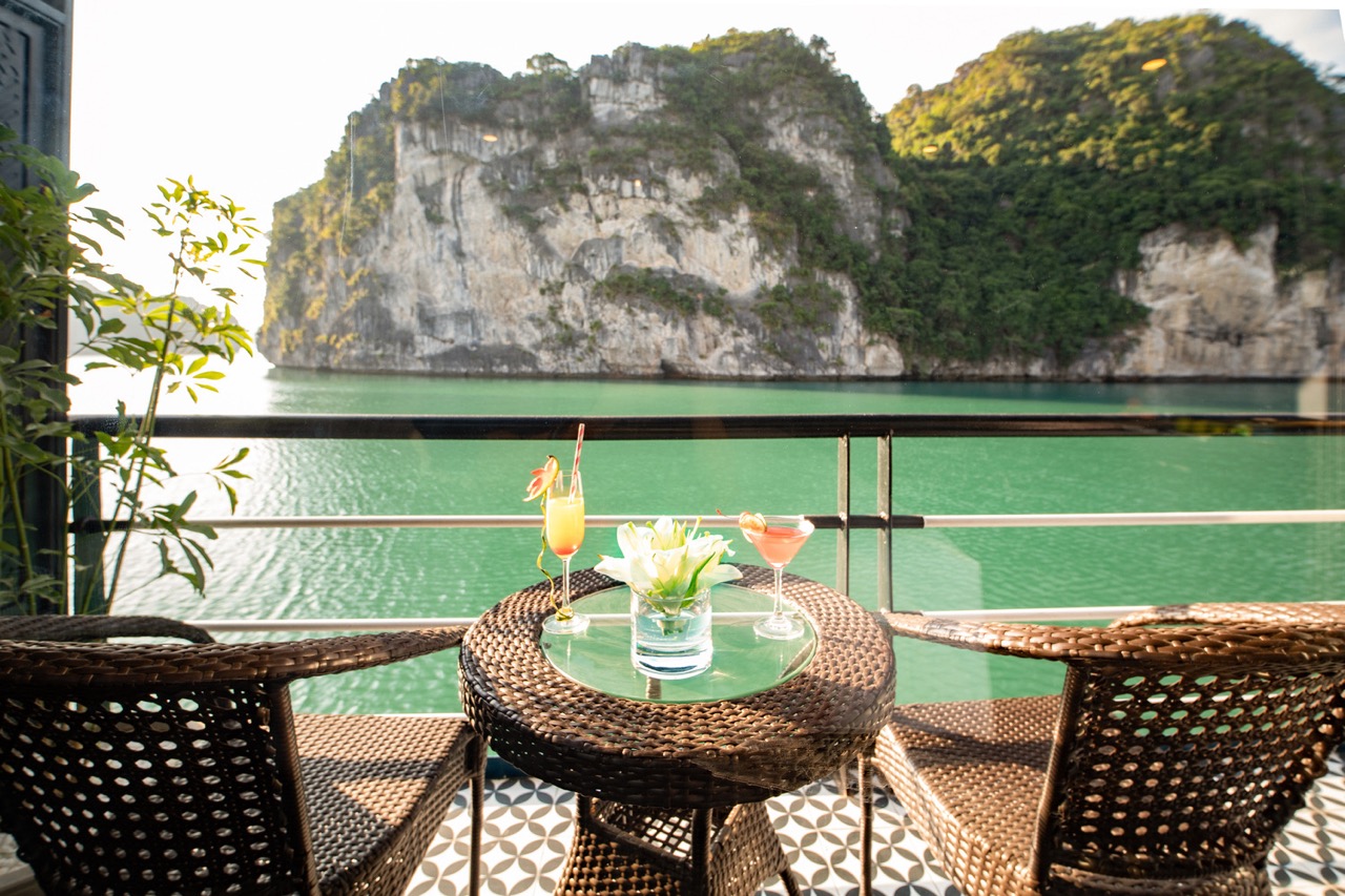 Scenic Halong Bay view from a luxurious cruise balcony with lush islands in the background, perfect.