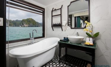 Stunning view of Halong Bay from a cruise balcony, perfect for a luxurious and relaxing experience.