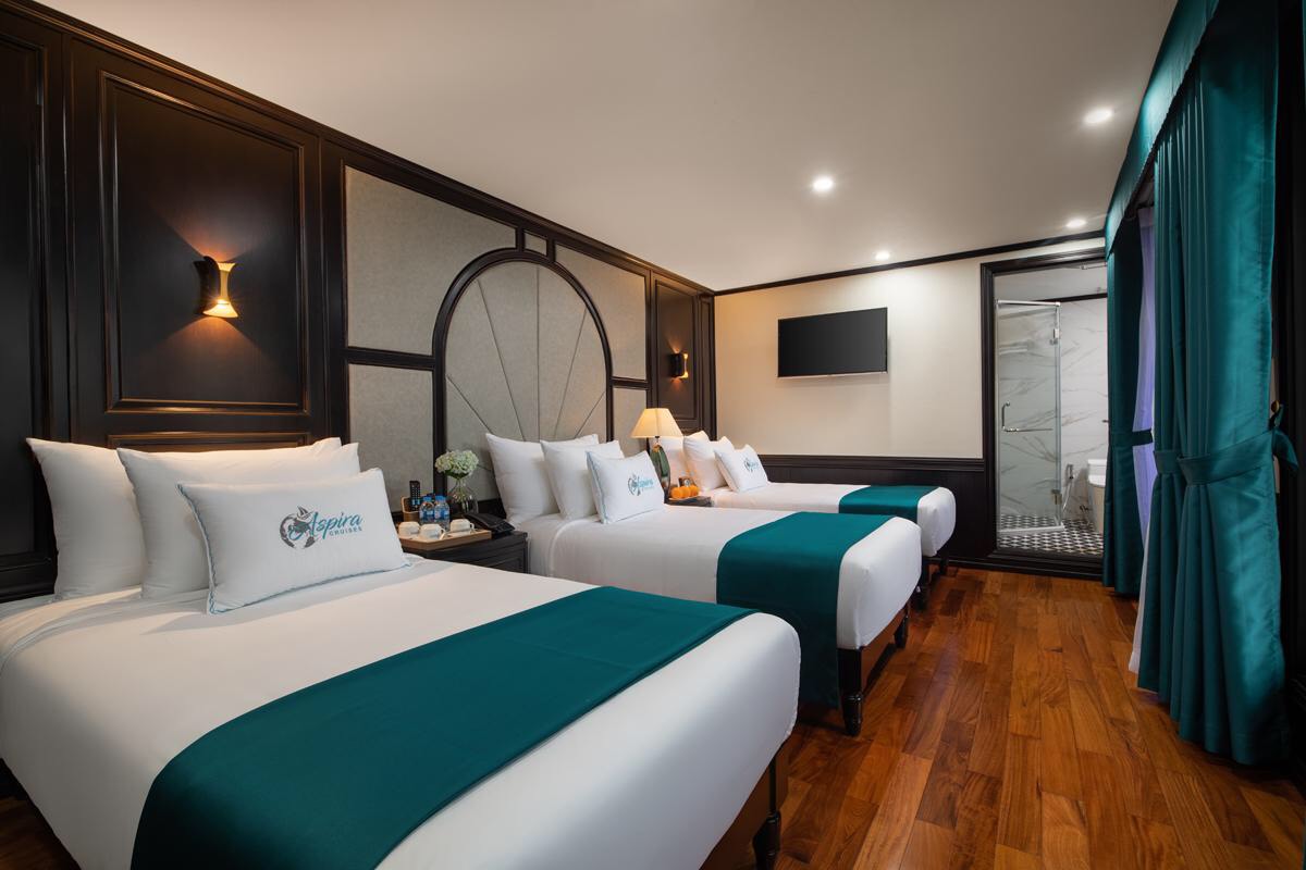 Elegant hotel room with modern decor, comfortable beds, and luxury amenities in Vietnam.