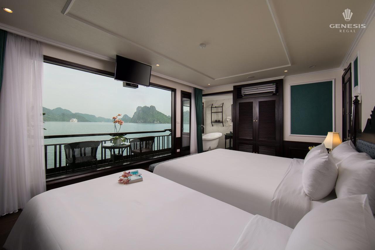 Stunning view of Halong Bay from a cruise balcony, showcasing serene waters and limestone karsts, pe.