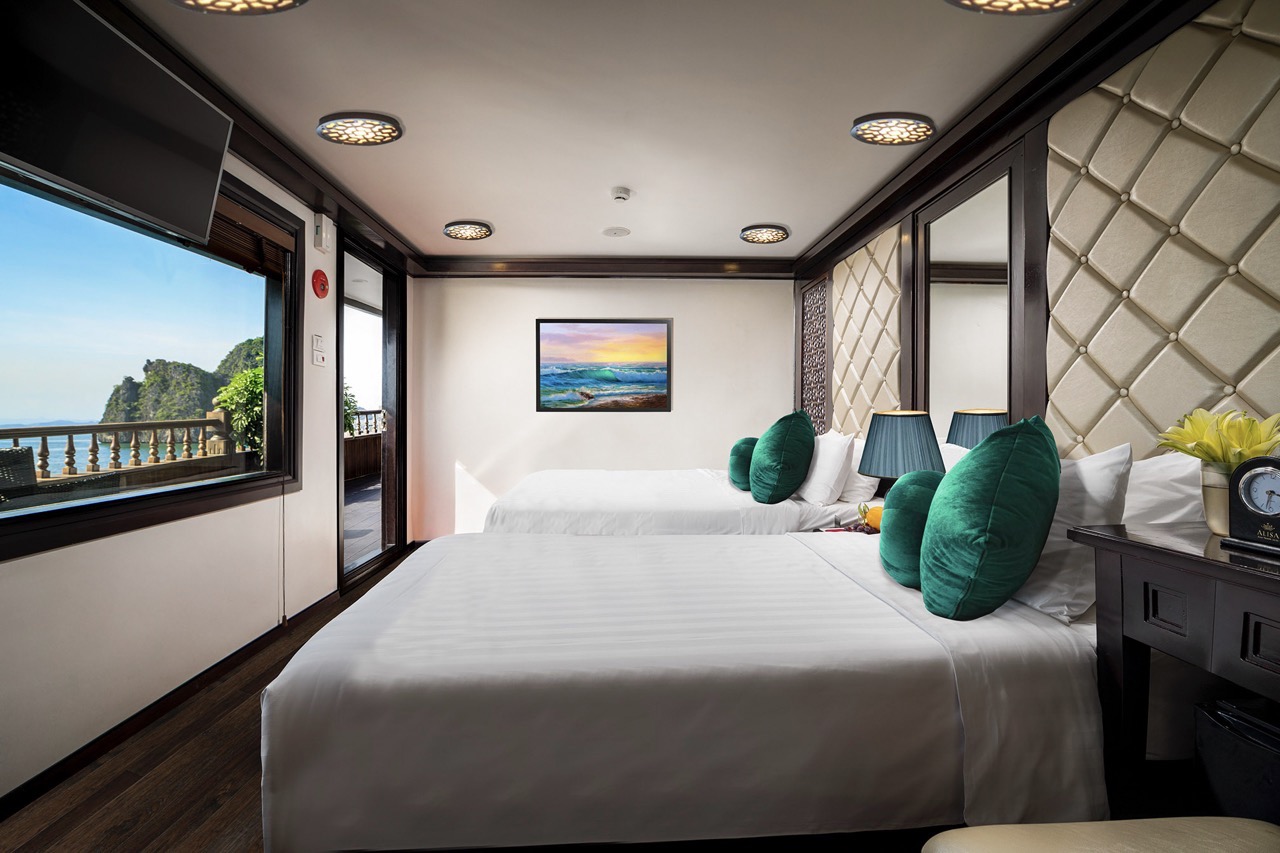 Elegant cruise room with panoramic ocean views and modern decor, perfect for a relaxing Halong Bay e.