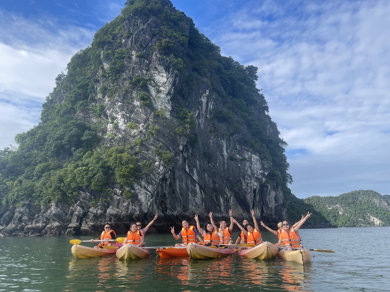 Enjoy kayaking and scenic views on a Halong Bay cruise with friends and family.