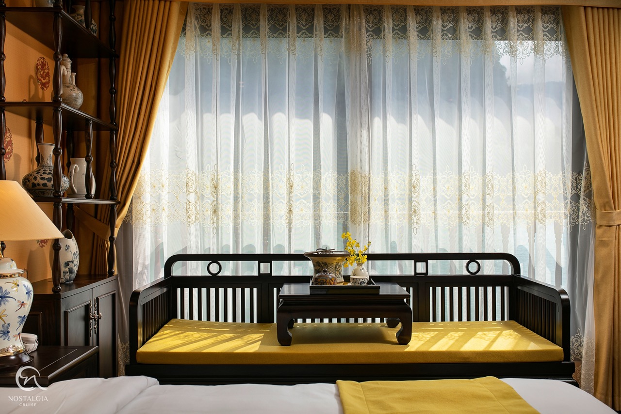 Scenic Halong Bay cruise balcony with luxurious seating and panoramic views, perfect for a relaxing.