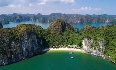 Spectacular view of Halong Bay with lush islands and clear waters, perfect for Vietnam travel adventures.