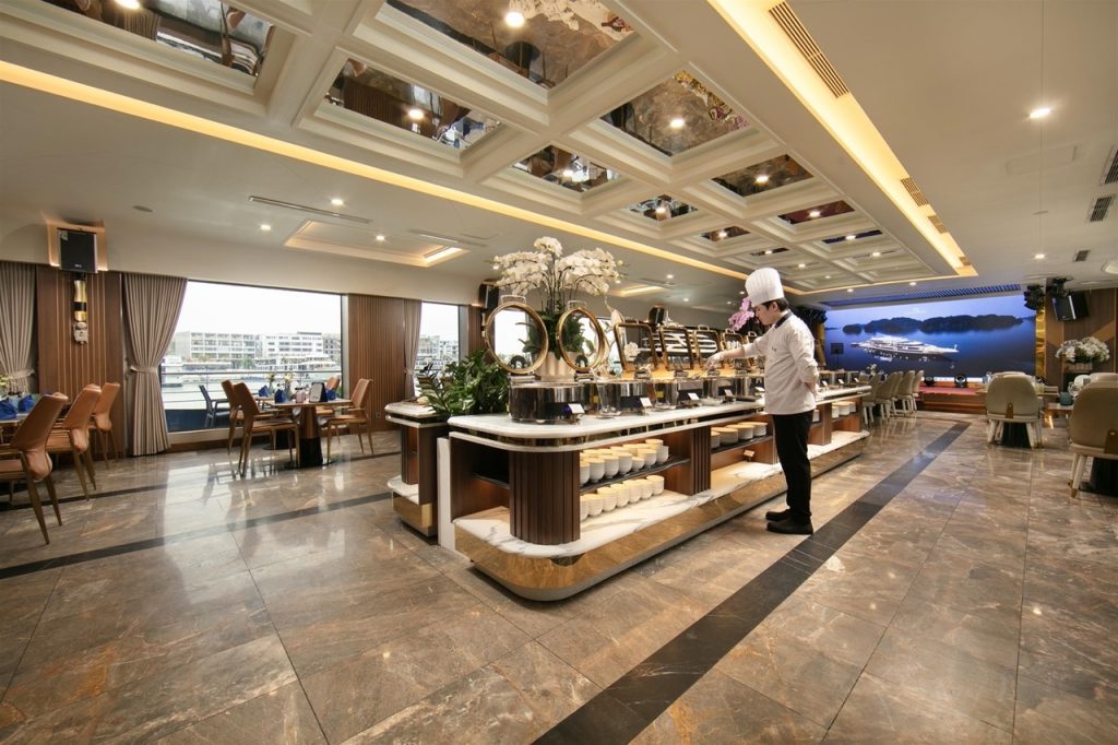 Luxurious cruise lounge with elegant decor and panoramic views of Halong Bay, perfect for relaxing d.