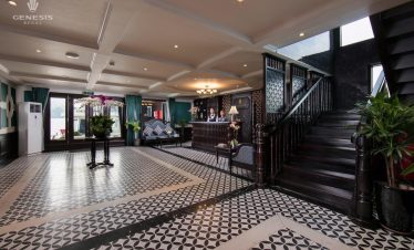 Luxurious interior of Genesis Regal Cruise with stylish furnishings and spacious seating area.