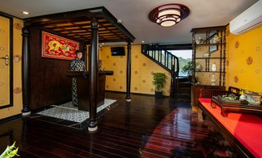 Elegant cruise lounge with traditional decor and cozy ambiance in Halong Bay.