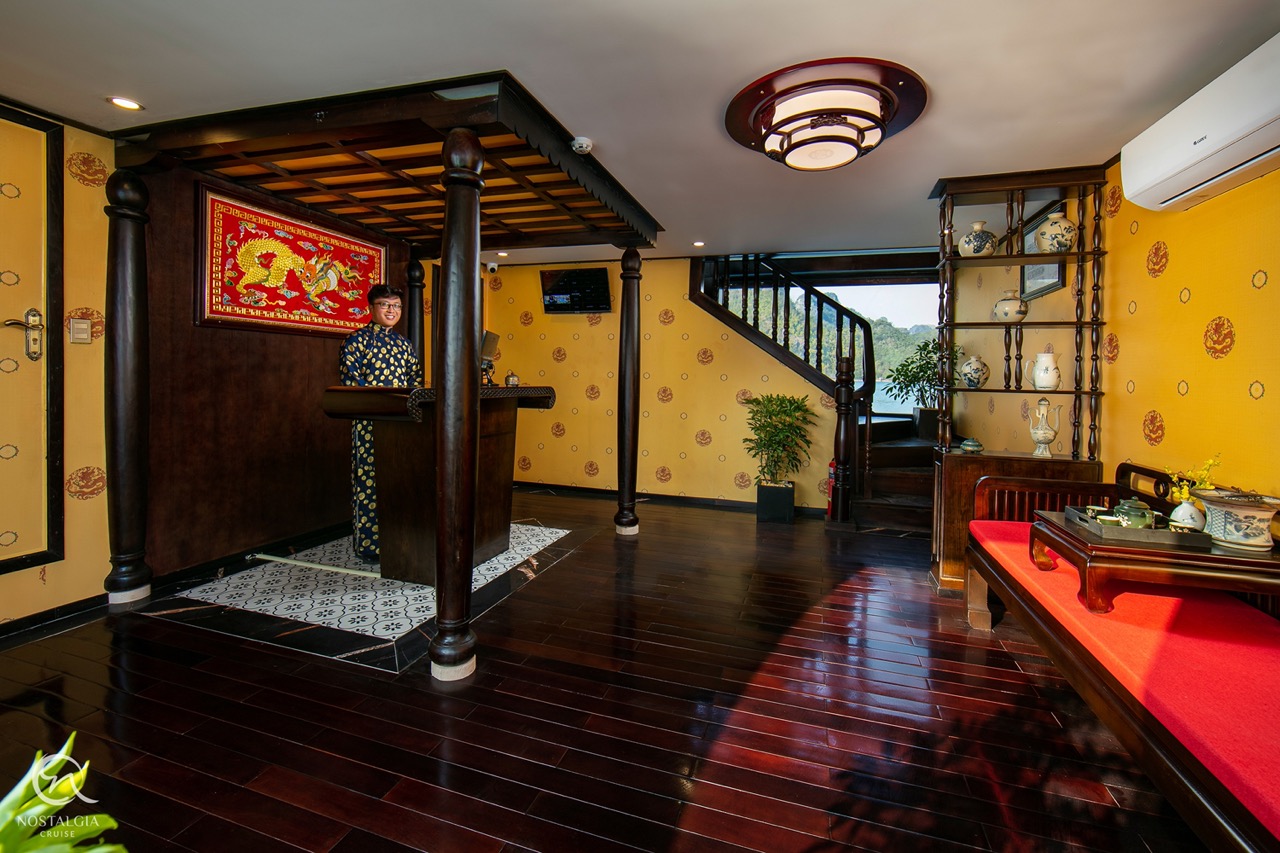 Elegant cruise lounge with traditional decor and cozy ambiance in Halong Bay.