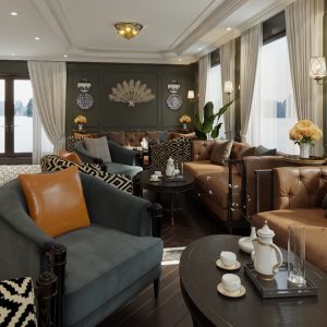 Luxurious waterfront hotel interior with elegant furnishings and scenic mountain views.