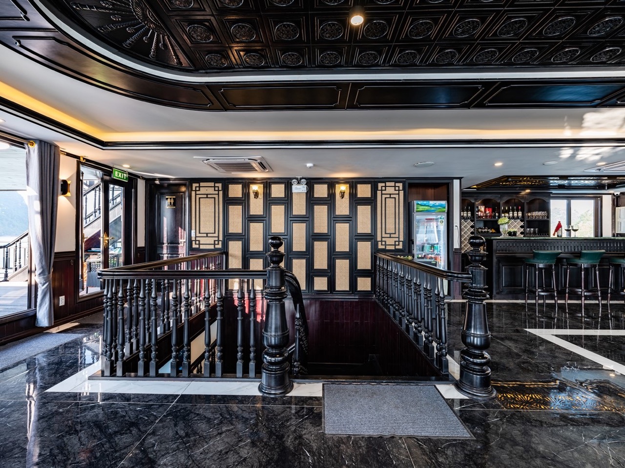 Elegant cruise lounge with stylish design and scenic views of Halong Bay, perfect for a relaxing 2D1.