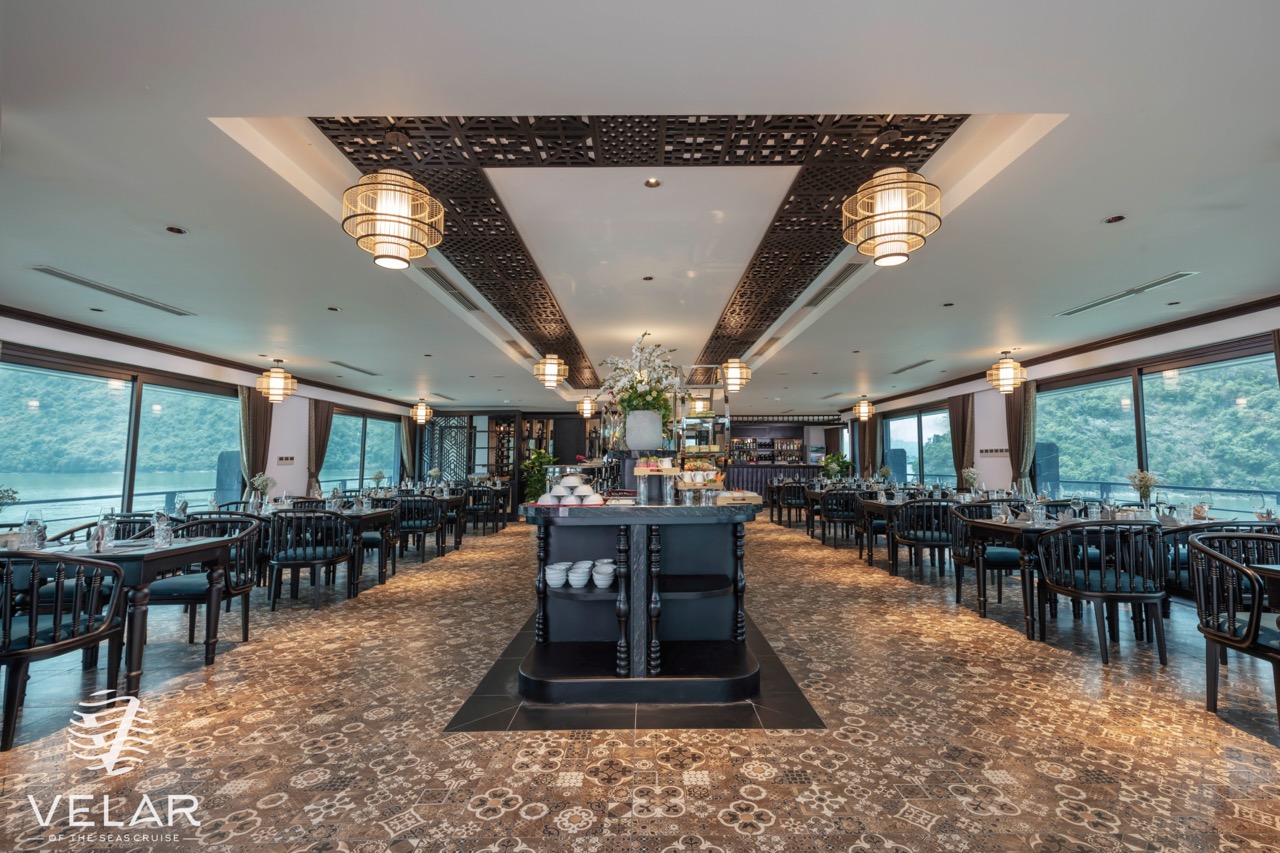 Luxurious cruise interior with panoramic windows, perfect for relaxing and enjoying Halong Bay views.