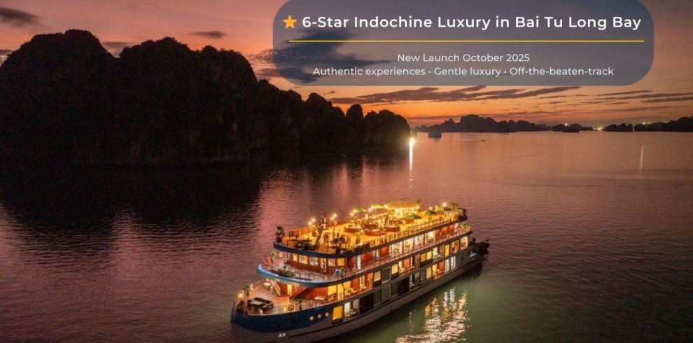 Luxurious cruise sailing through Bai Tu Long Bay at sunset, showcasing stunning natural beauty and s.