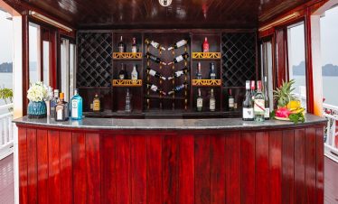 Luxurious cruise bar with scenic views in Halong Bay, perfect for relaxing and enjoying drinks.