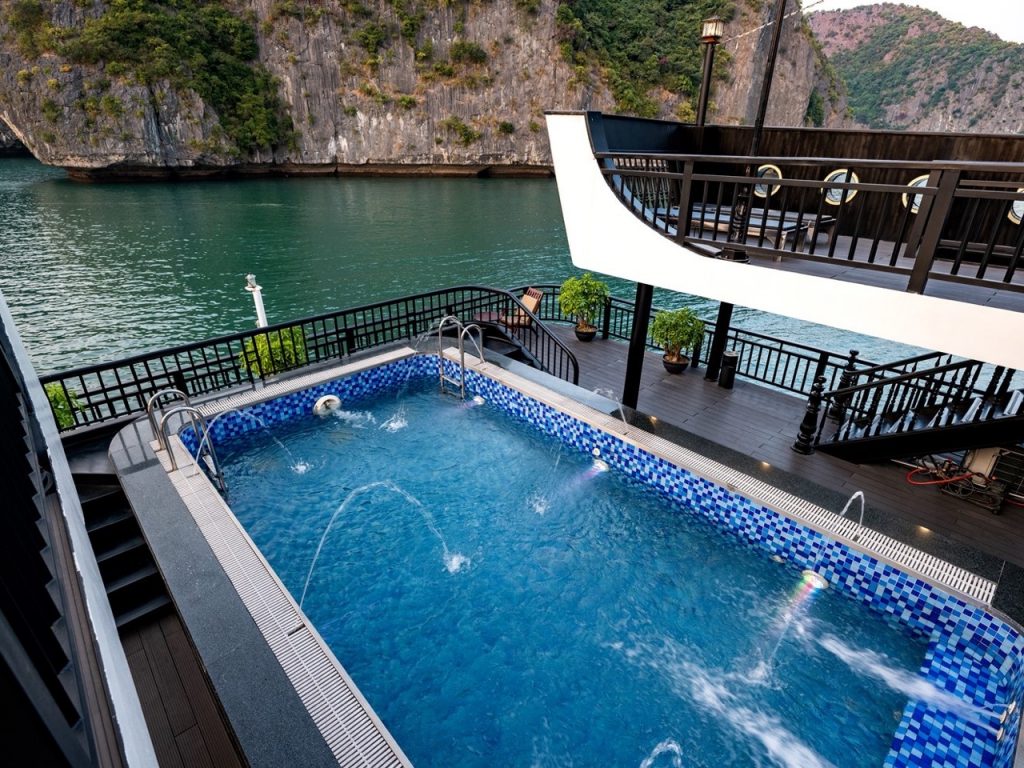 Luxury Halong Bay cruise balcony with private pool, stunning views, and relaxing atmosphere.