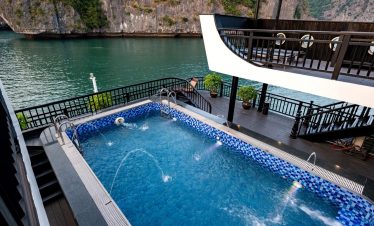 Luxury Halong Bay cruise balcony with private pool, stunning views, and relaxing atmosphere.