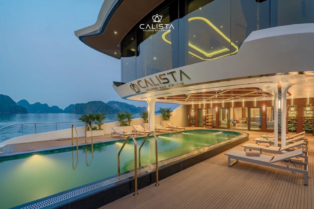 Luxurious cruise balcony overlooking Halong Bay with scenic views and relaxing atmosphere.