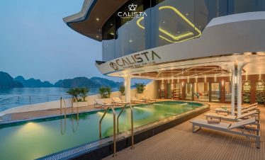 Luxurious cruise balcony overlooking Halong Bay with scenic views and relaxing atmosphere.