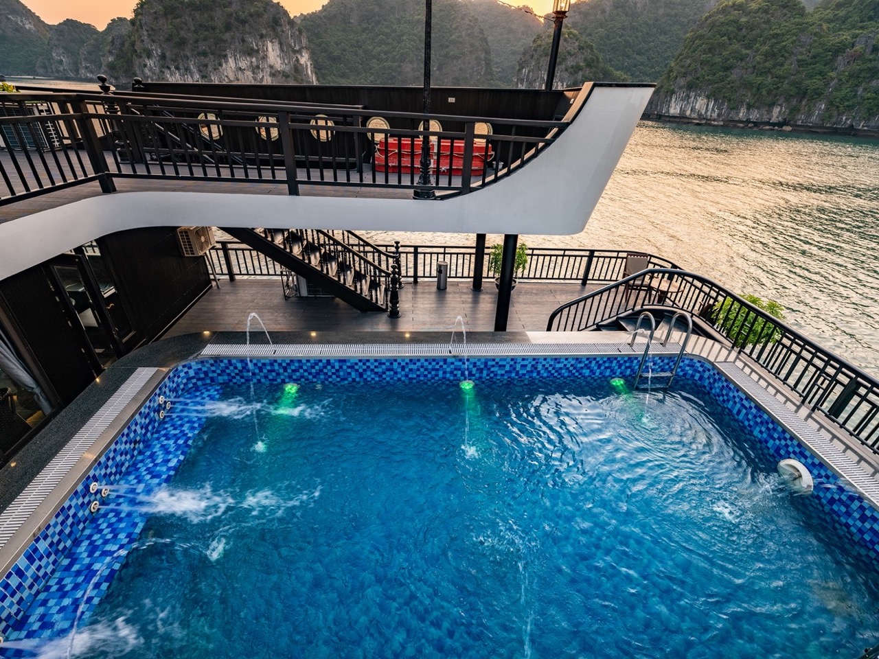 Stunning view from cruise balcony in Halong Bay with scenic limestone karsts.