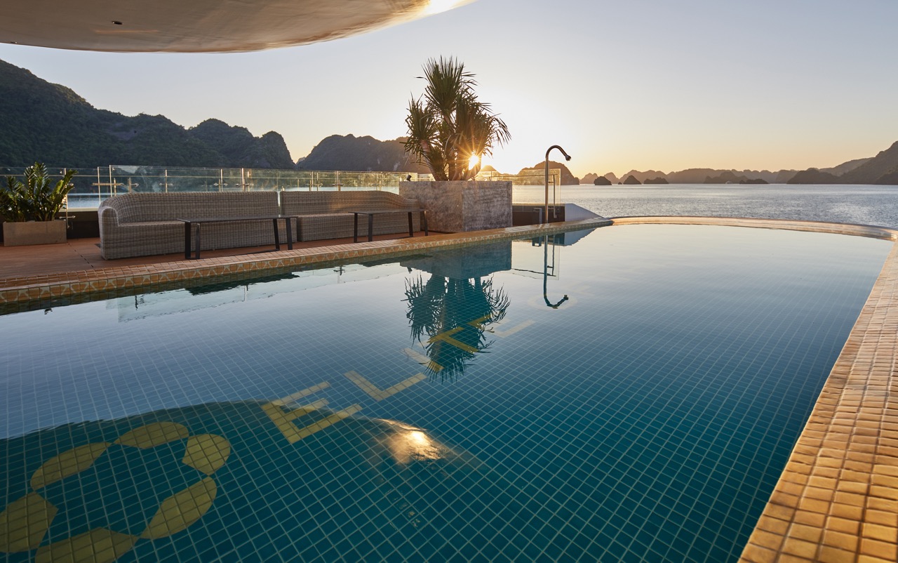 Stunning infinity pool overlooking Halong Bay with scenic mountain backdrop at Elite Of The Seas.