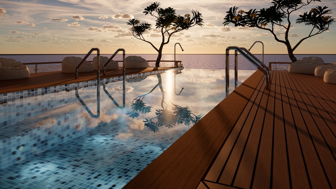 Luxurious infinity pool overlooking ocean at sunset.