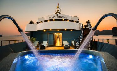 Luxury cruise balcony view in Halong Bay at sunset, perfect for relaxing and sightseeing.