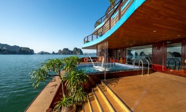 Luxury Bai Tu Long Bay cruise balcony with ocean view and deck.