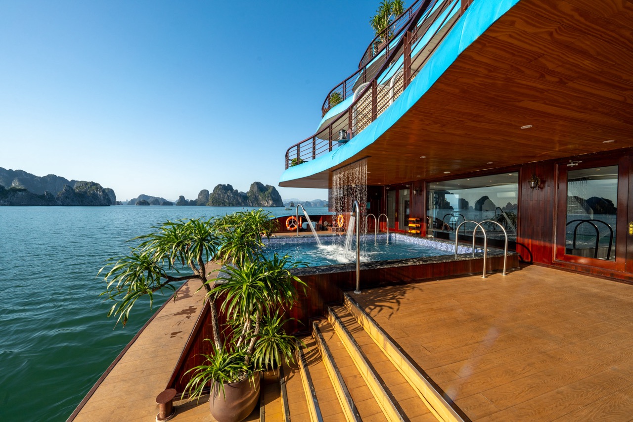 Luxury Bai Tu Long Bay cruise balcony with ocean view and deck.