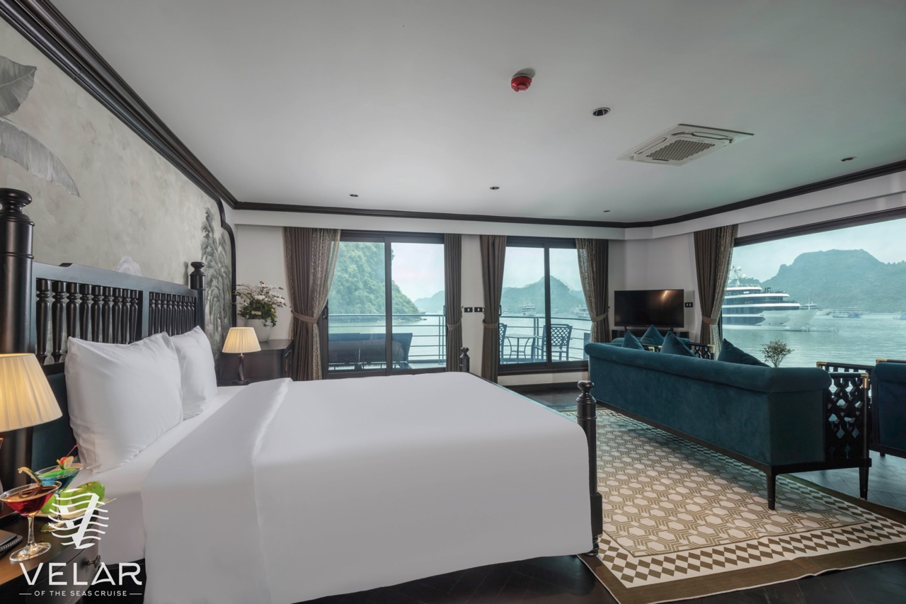 Elegant cruise cabin with panoramic bay views, perfect for a relaxing Halong Bay cruise experience.