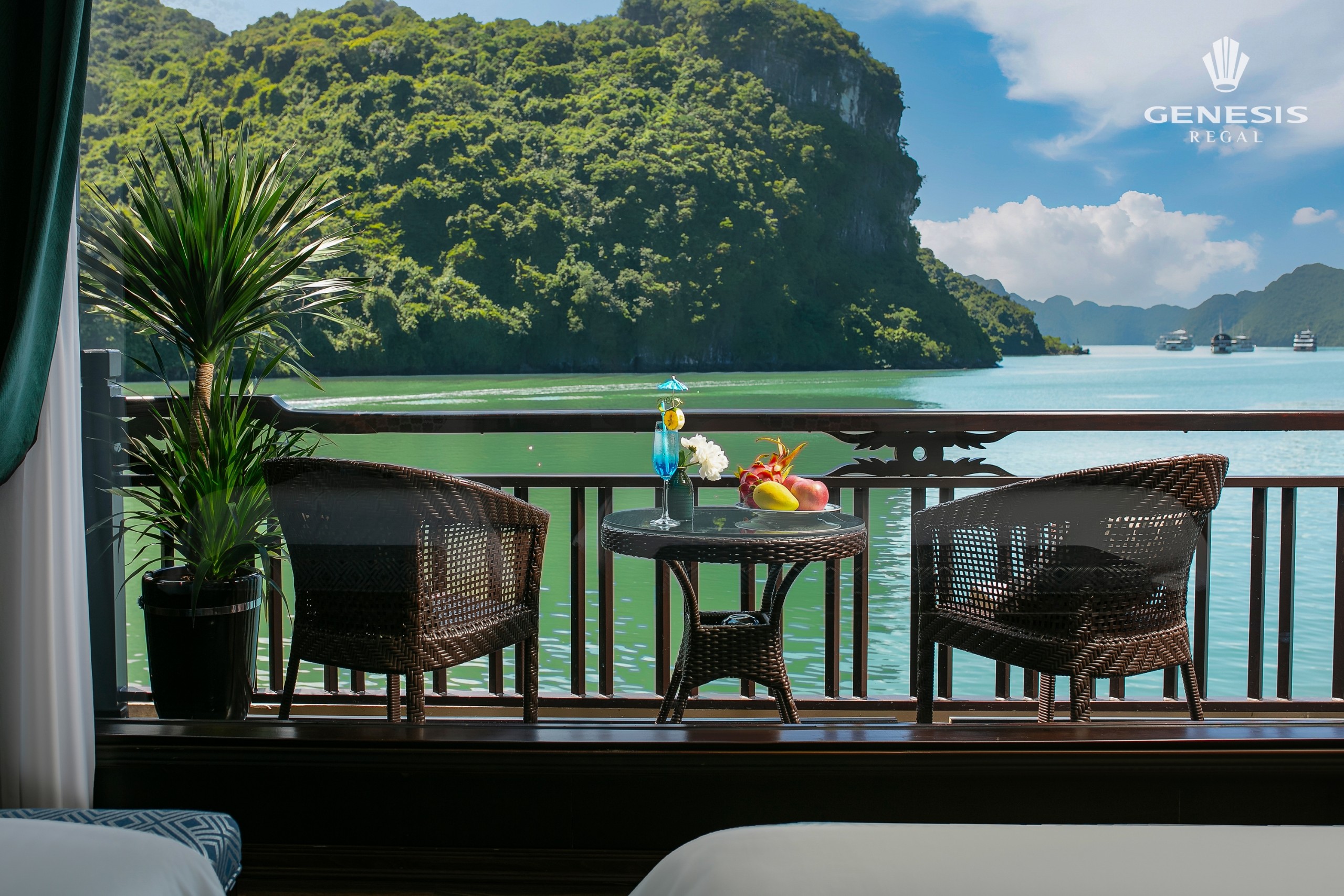 Stunning view of Halong Bay from a cruise balcony with lush green islands and tranquil waters, perfe.