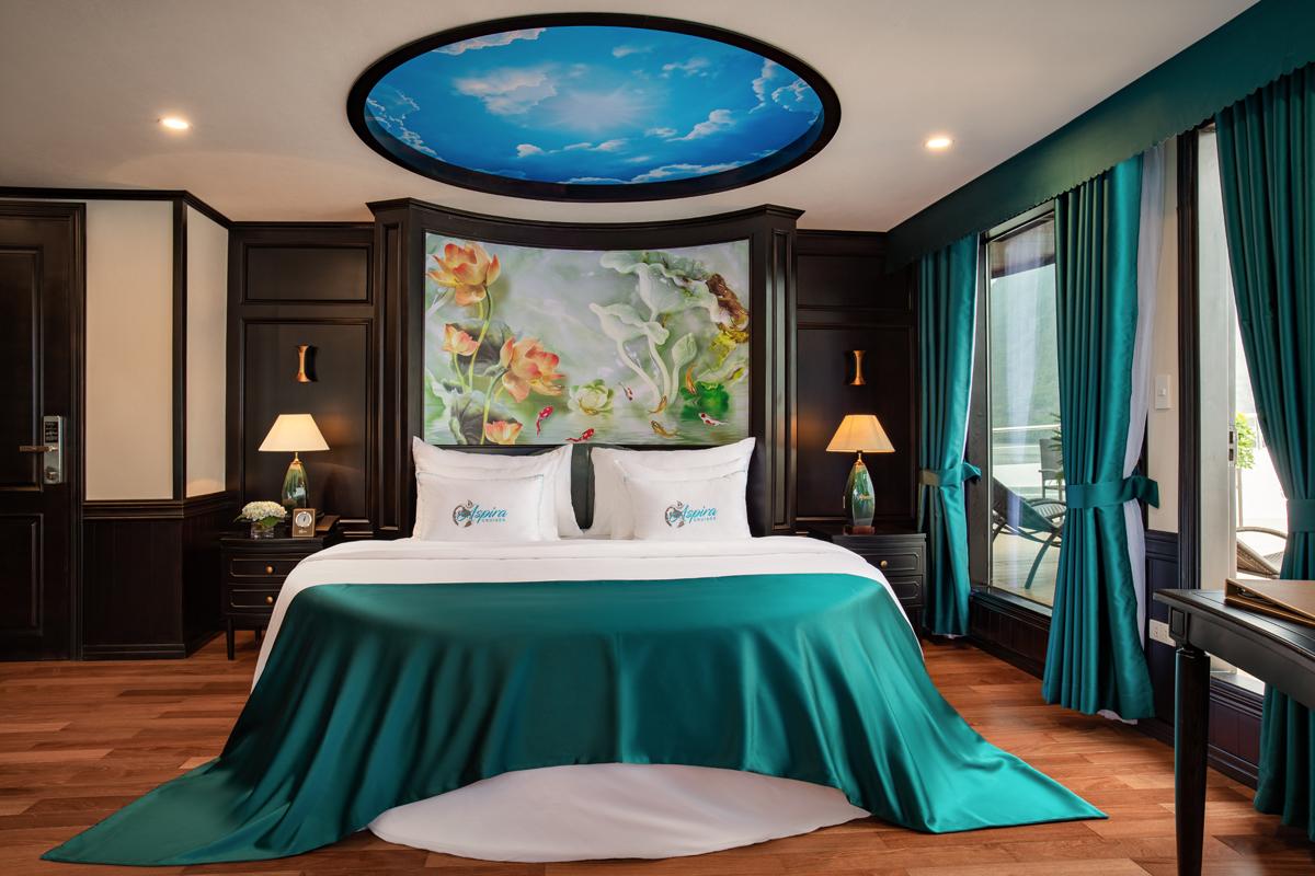 Luxurious hotel room with elegant decor, teal accents, and scenic views from private balcony at ViettrendTour.