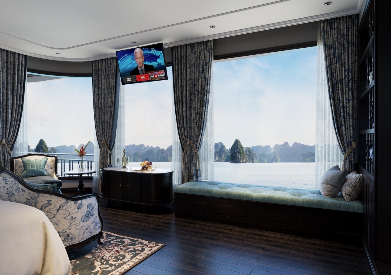 Stunning Lan Ha Bay scenery from a cruise balcony, showcasing tranquil waters and dramatic limestone.