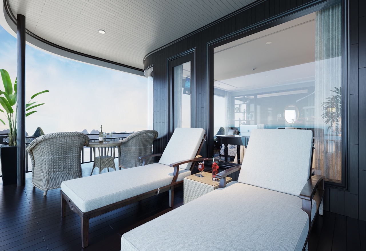 Stunning cruise balcony overlooking Lan Ha Bay with luxurious lounge chairs for relaxation.