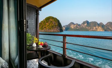 Stunning view of Halong Bay from a cruise balcony, perfect for relaxing and enjoying the scenic beau.