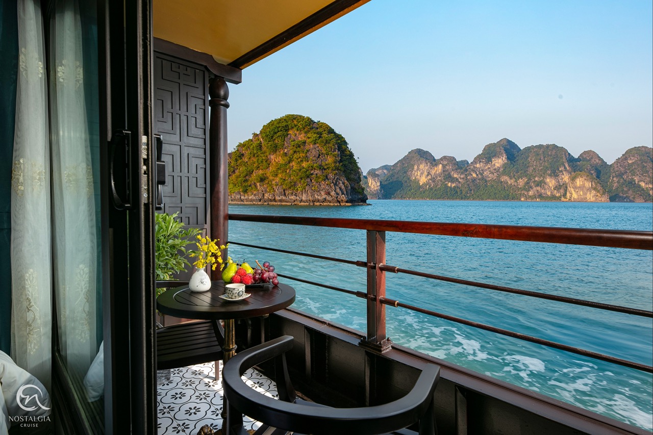 Stunning view of Halong Bay from a cruise balcony, perfect for relaxing and enjoying the scenic beau.
