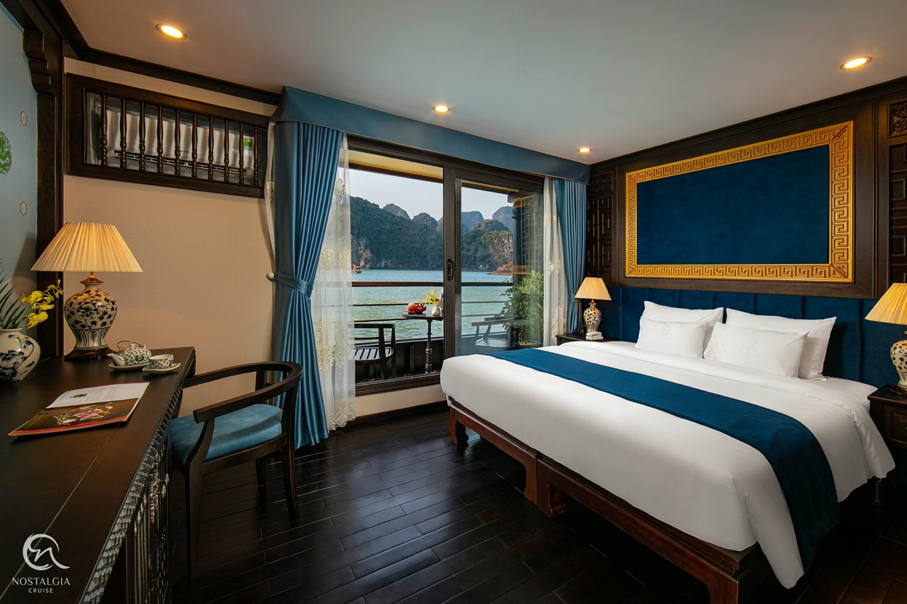 Stunning Halong Bay cruise balcony showcasing serene waters and lush islands.