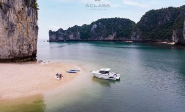 Scenic Halong Bay cruise scene with boat, limestone cliffs, and tranquil waters, perfect for explori.