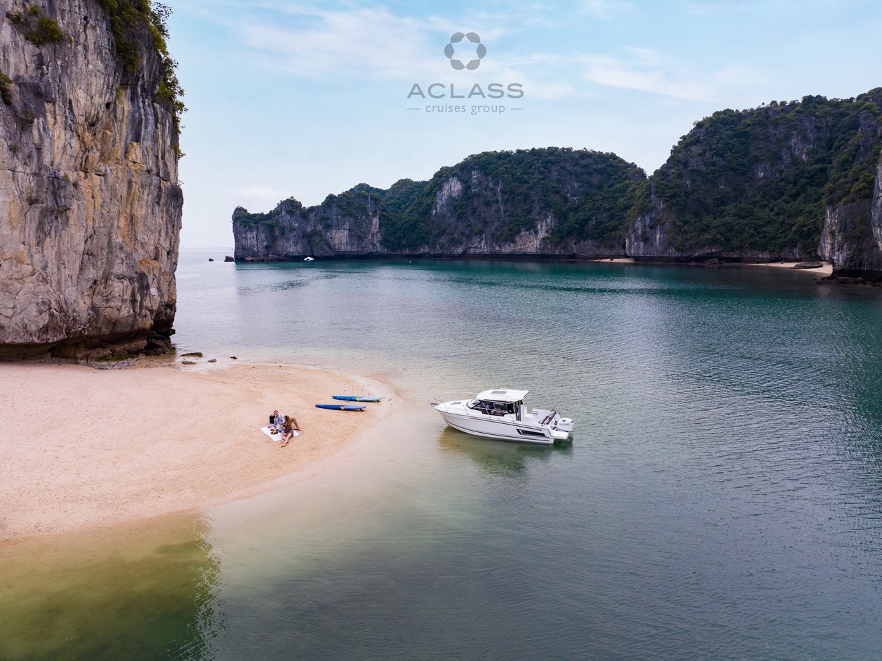 Scenic Halong Bay cruise scene with boat, limestone cliffs, and tranquil waters, perfect for explori.