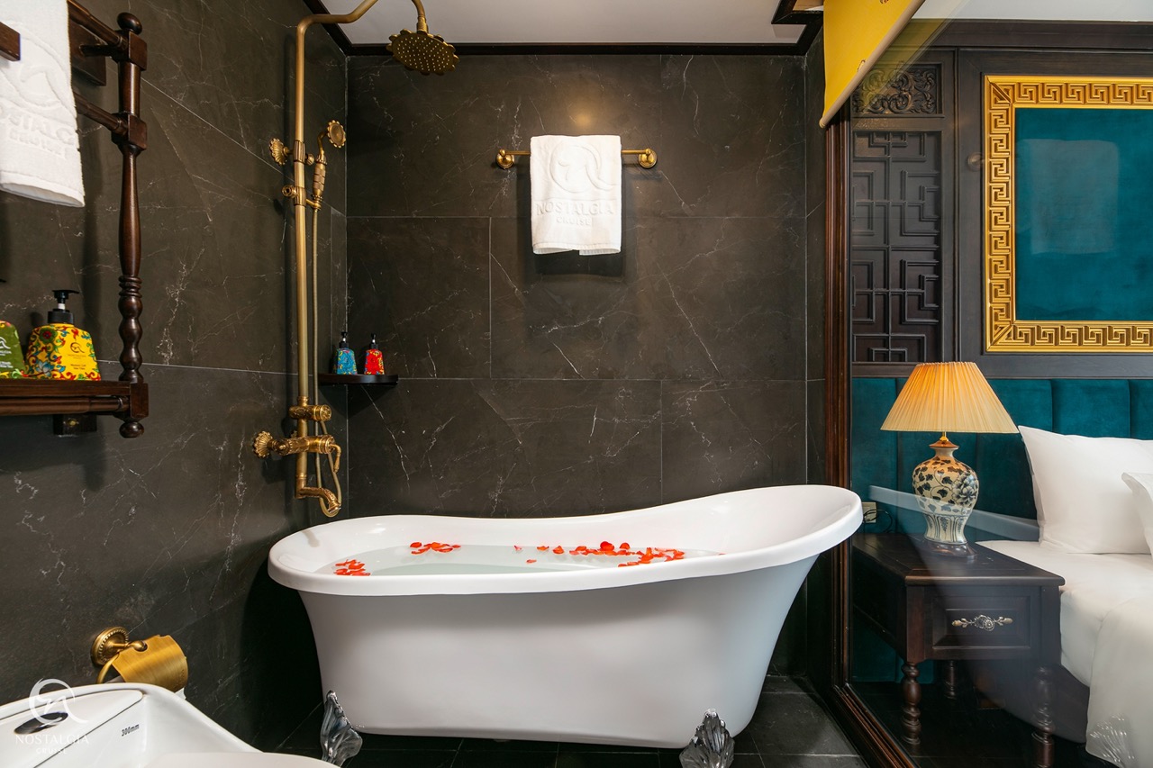 Elegant bathroom with bathtub and modern decor in Halong Bay cruise.