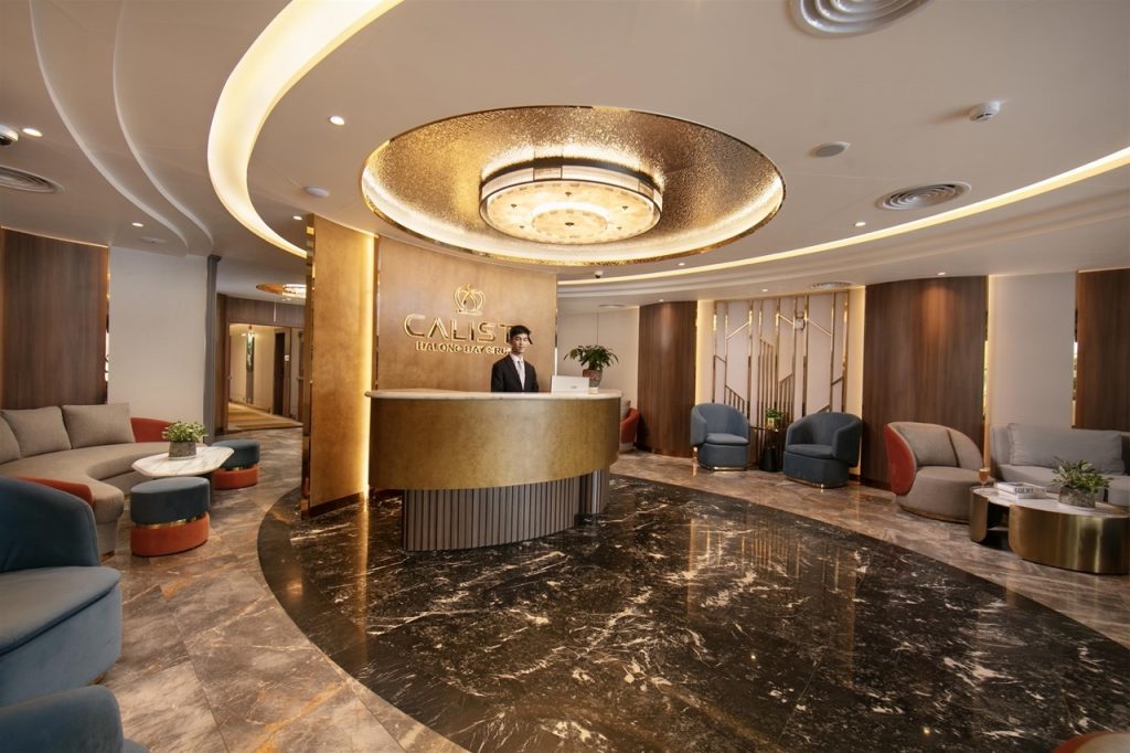Elegant cruise lobby with modern decor and warm lighting, perfect for relaxing before exploring Halo.