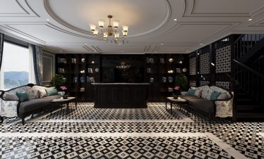 Luxurious cruise lounge interior with elegant decor and panoramic views of Lan Ha Bay.